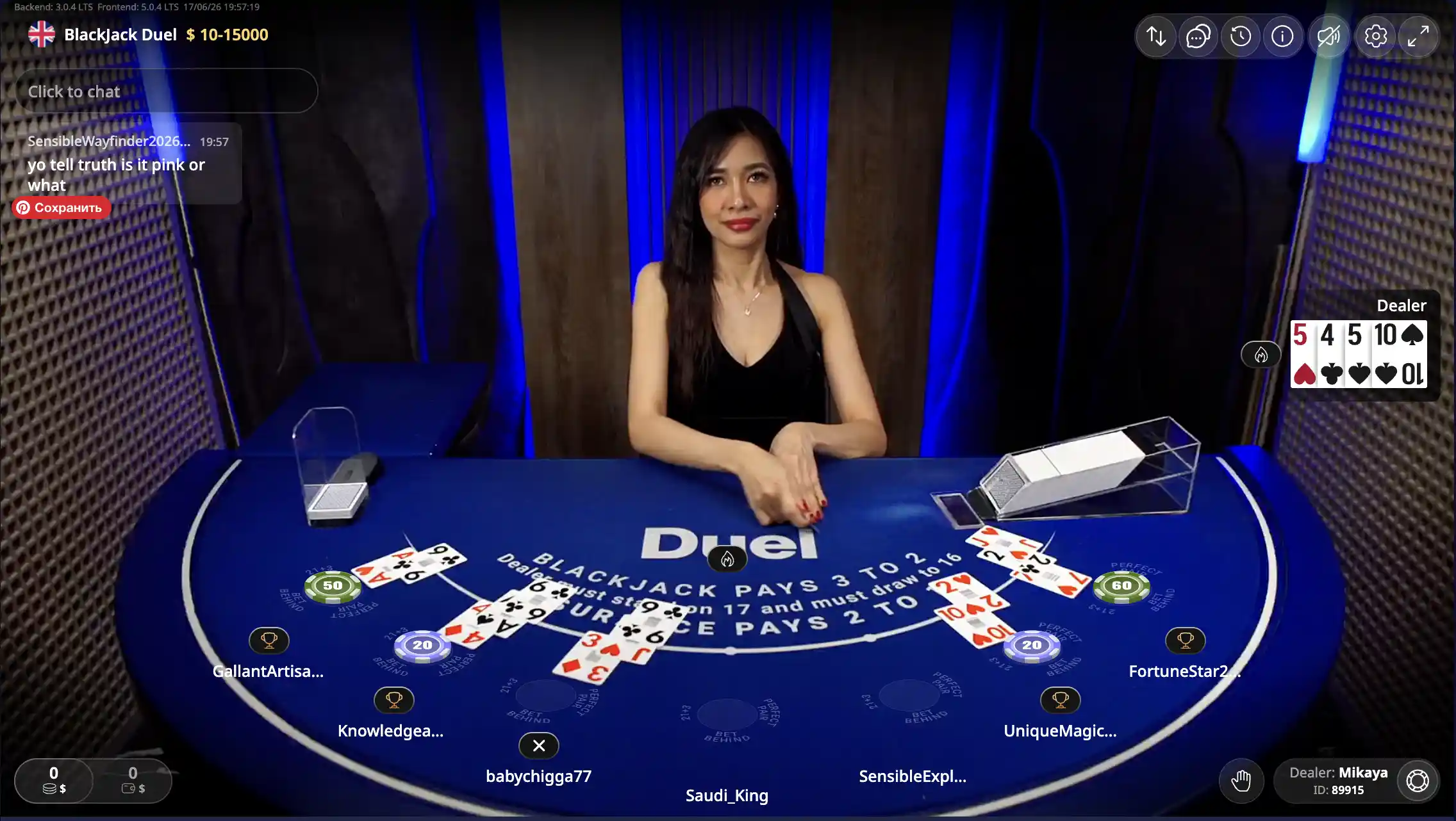 Duel live Blackjack table with branded blue felt, live dealer and player hands at $10–15000 stakes